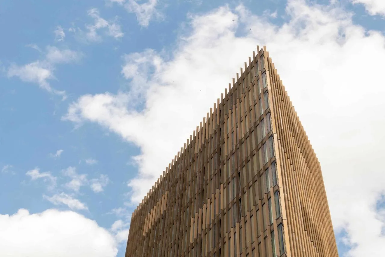 a tall brown building with a sky in the background at Cove Paradise Street in Liverpool